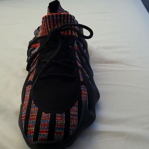 A sock knit shoe with a unique rubber sole.